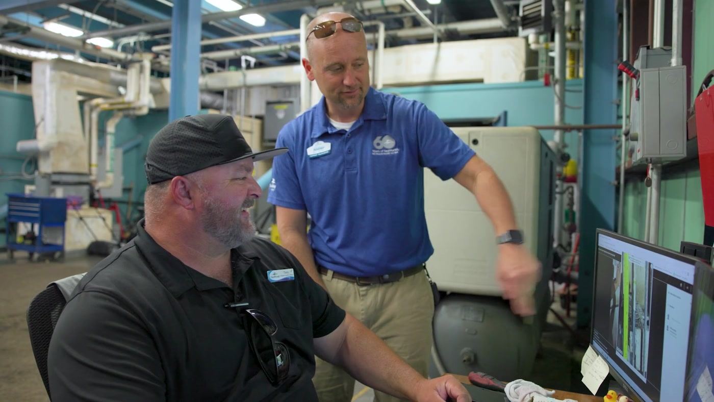 Maintenance leaders reviewing inspection status on a desktop screen
